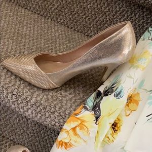 Striking shoe game! Gold tone by Aldo!